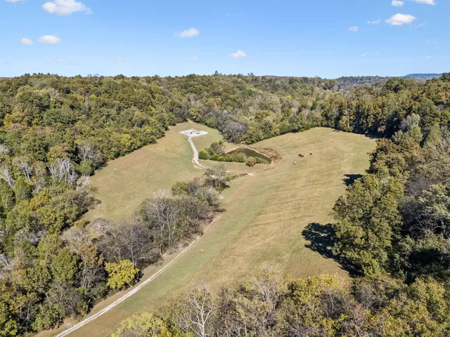 a view of a house with a yard balcony and seating area