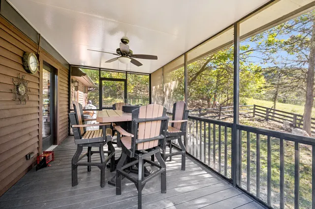 a view of a swimming pool with an outdoor seating