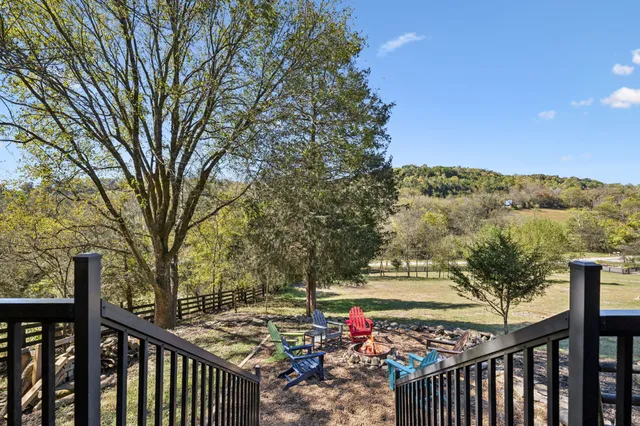 a view of an empty room with a kitchen