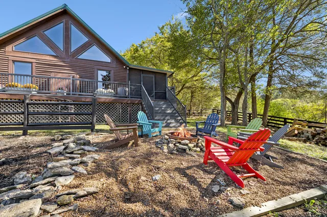 a view of a field with an ocean in the background