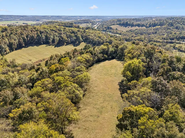 a view of a balcony with wooden floor and fence