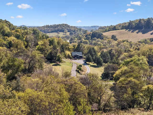 a living room filled with furniture and a fireplace