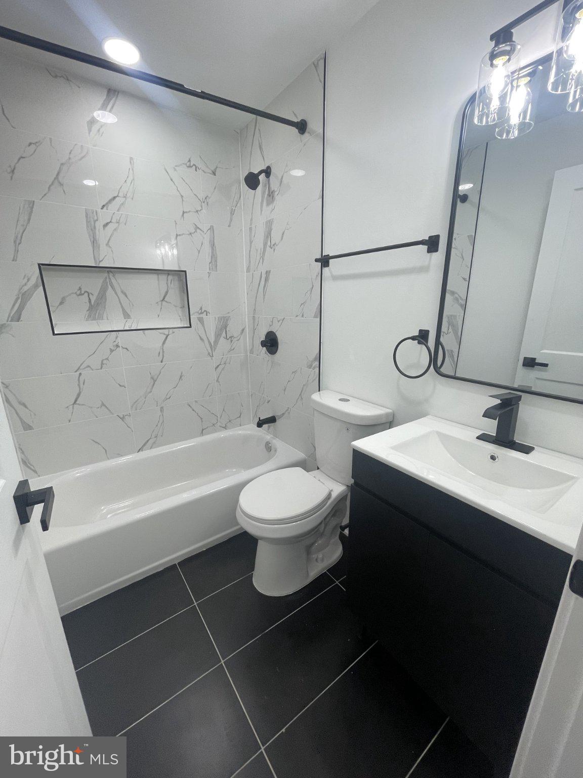 5719 Cambridge Street, Unit 1 Philadelphia, PA 19131 - Photo 5 of 6 Sleek modern bathroom with elegant finishes.
