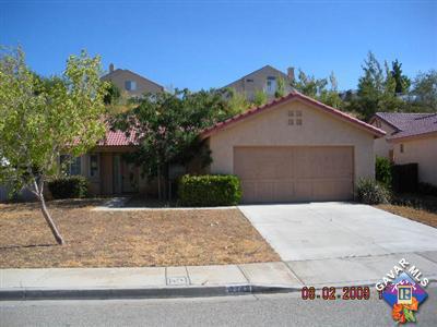 3142 Quarry Road Palmdale, CA 93550 - Photo 1 of 1 a front view of a house with a yard
