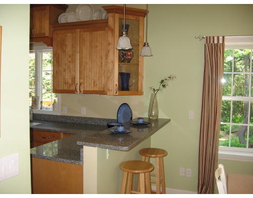 134 Mashapaug Road Sturbridge, MA 01566 - Photo 4 of 30 a bathroom with a granite countertop sink a mirror and shower