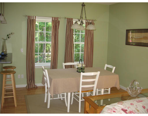 134 Mashapaug Road Sturbridge, MA 01566 - Photo 7 of 30 a view of a dining room with furniture and chandelier