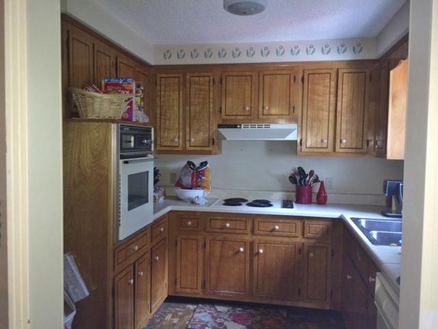 219 Wynns Ferry Road Dover, TN 37058 - Photo 6 of 11 Kitchen has cooktop range and wall-mounted stove and lots of cabinetry.