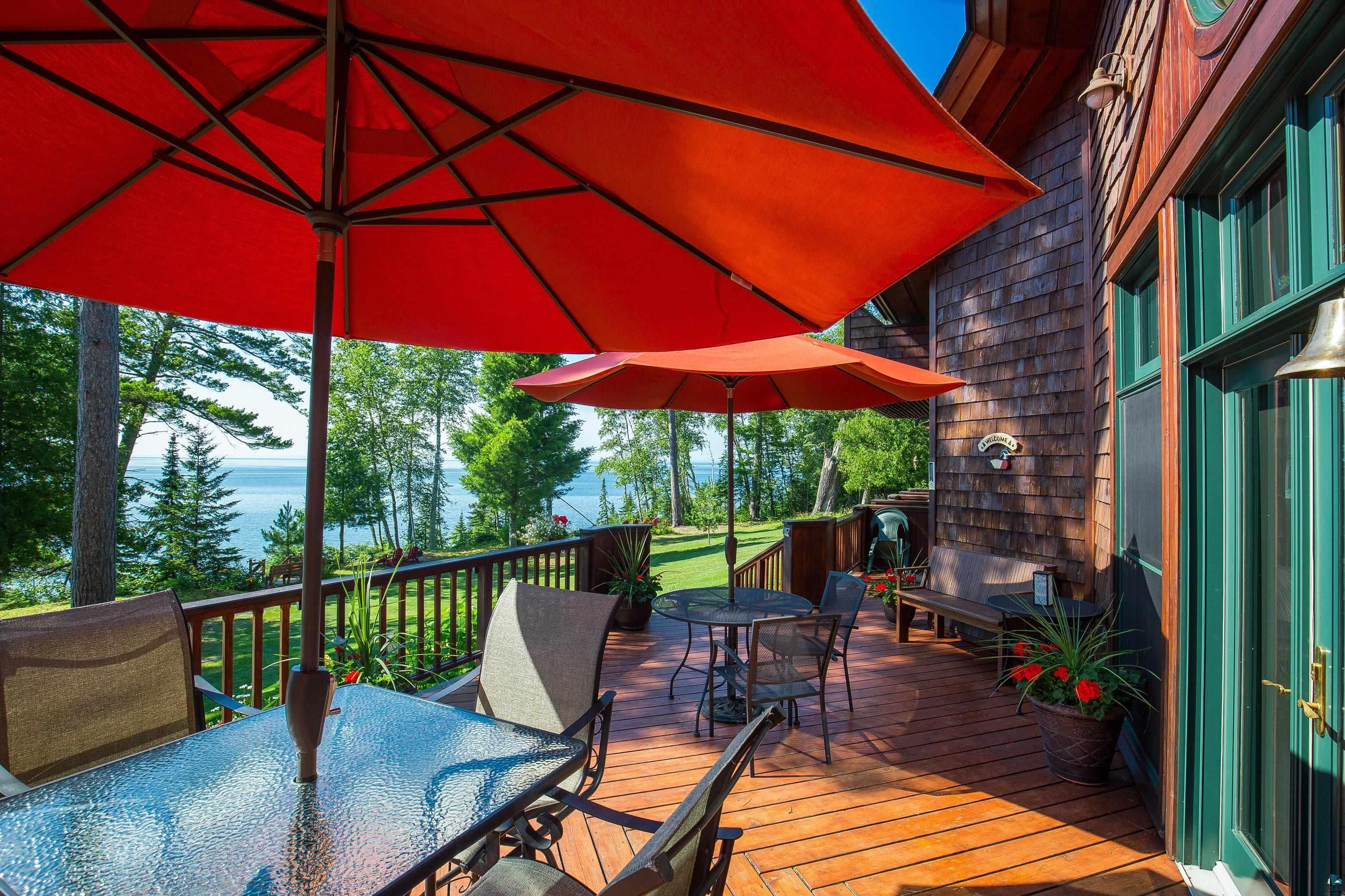 89405 Jack Pine Road Cornucopia, WI 54827 - Photo 16 of 60 Wooden deck featuring outdoor dining area