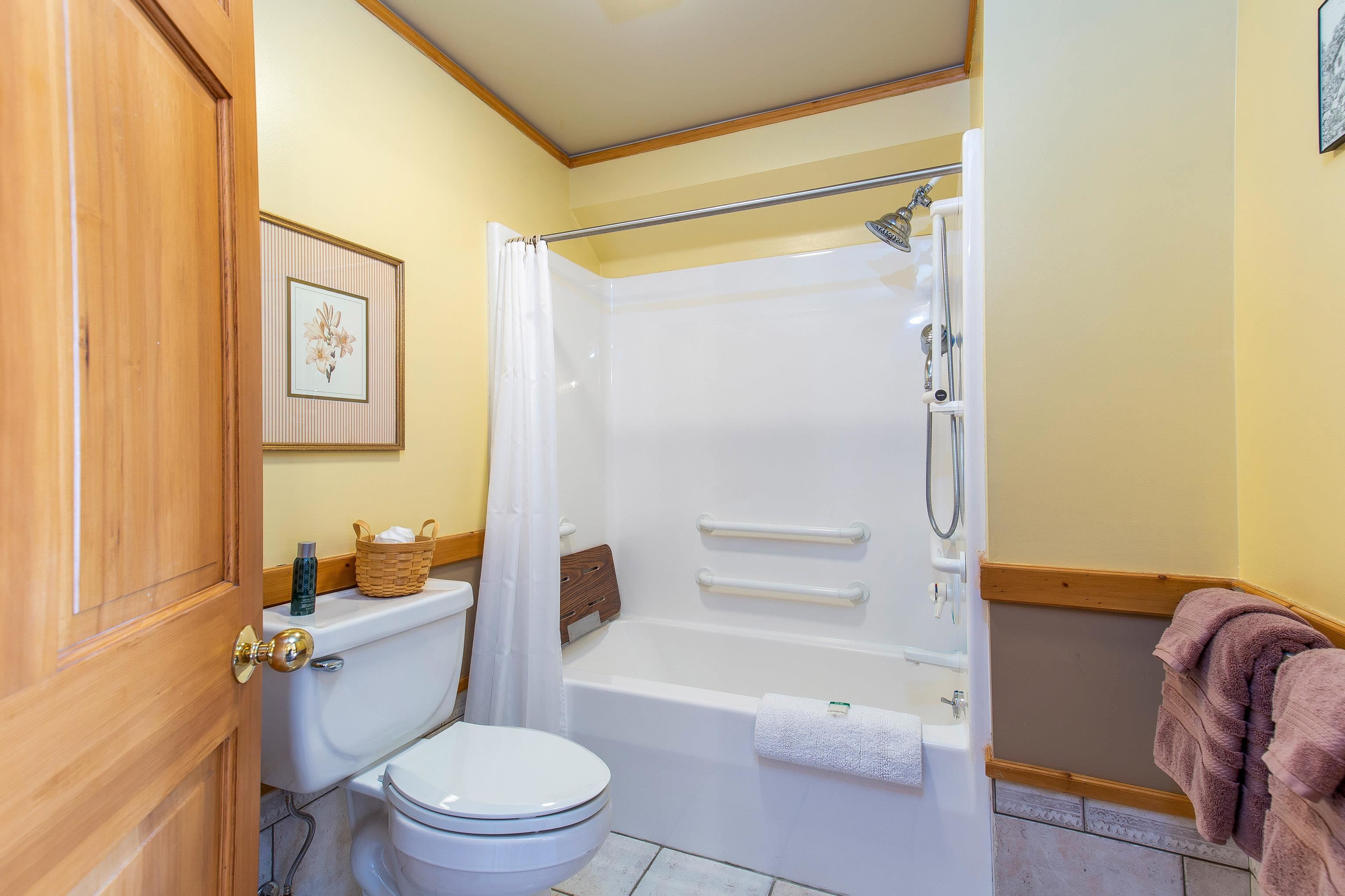 89405 Jack Pine Road Cornucopia, WI 54827 - Photo 38 of 60 Full bath featuring shower / tub combo with curtain, tile patterned floors, and crown molding