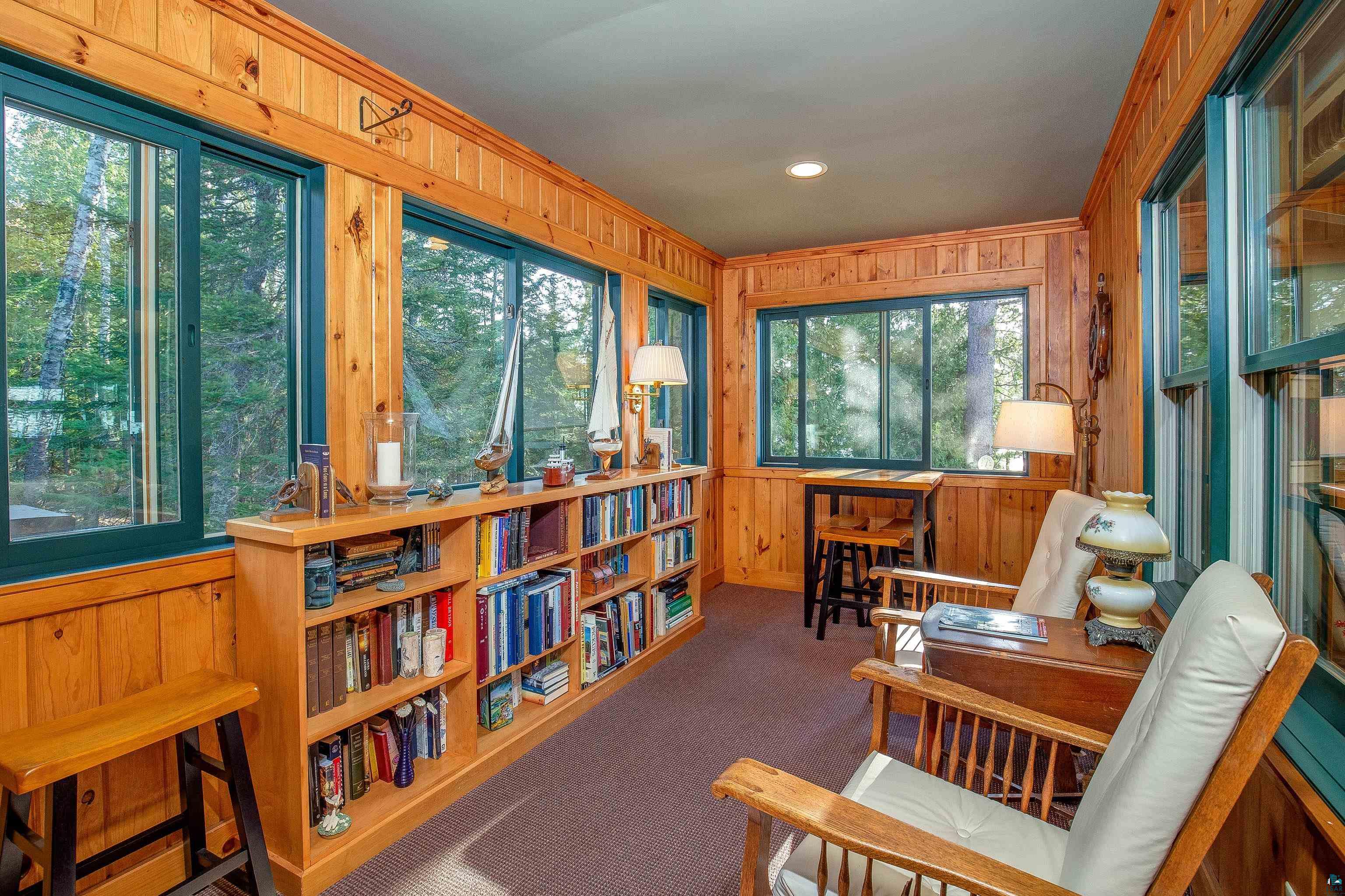 89405 Jack Pine Road Cornucopia, WI 54827 - Photo 49 of 60 Sunroom featuring wood walls, carpet floors, crown molding, and recessed lighting