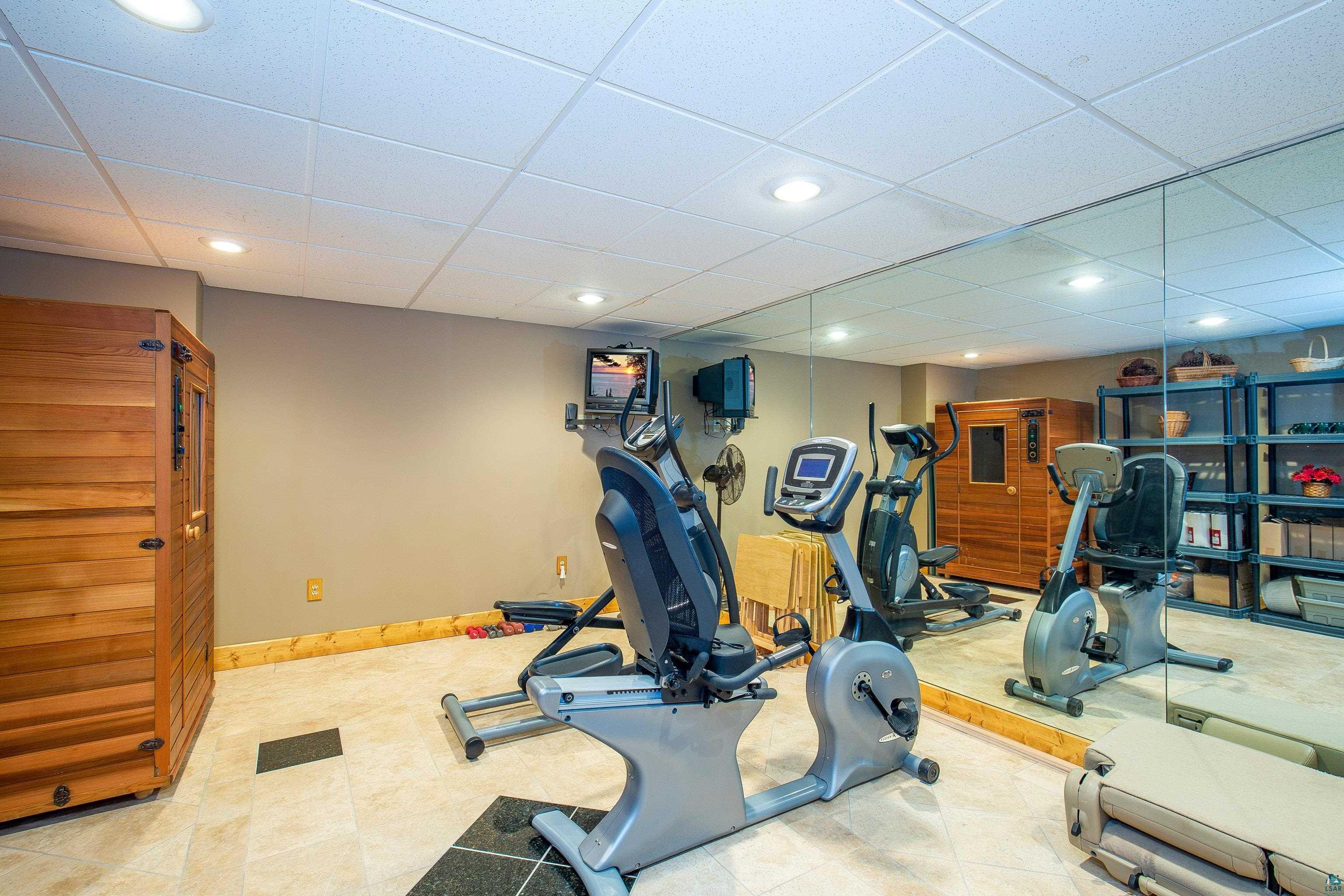 89405 Jack Pine Road Cornucopia, WI 54827 - Photo 51 of 60 Exercise area with a paneled ceiling and recessed lighting