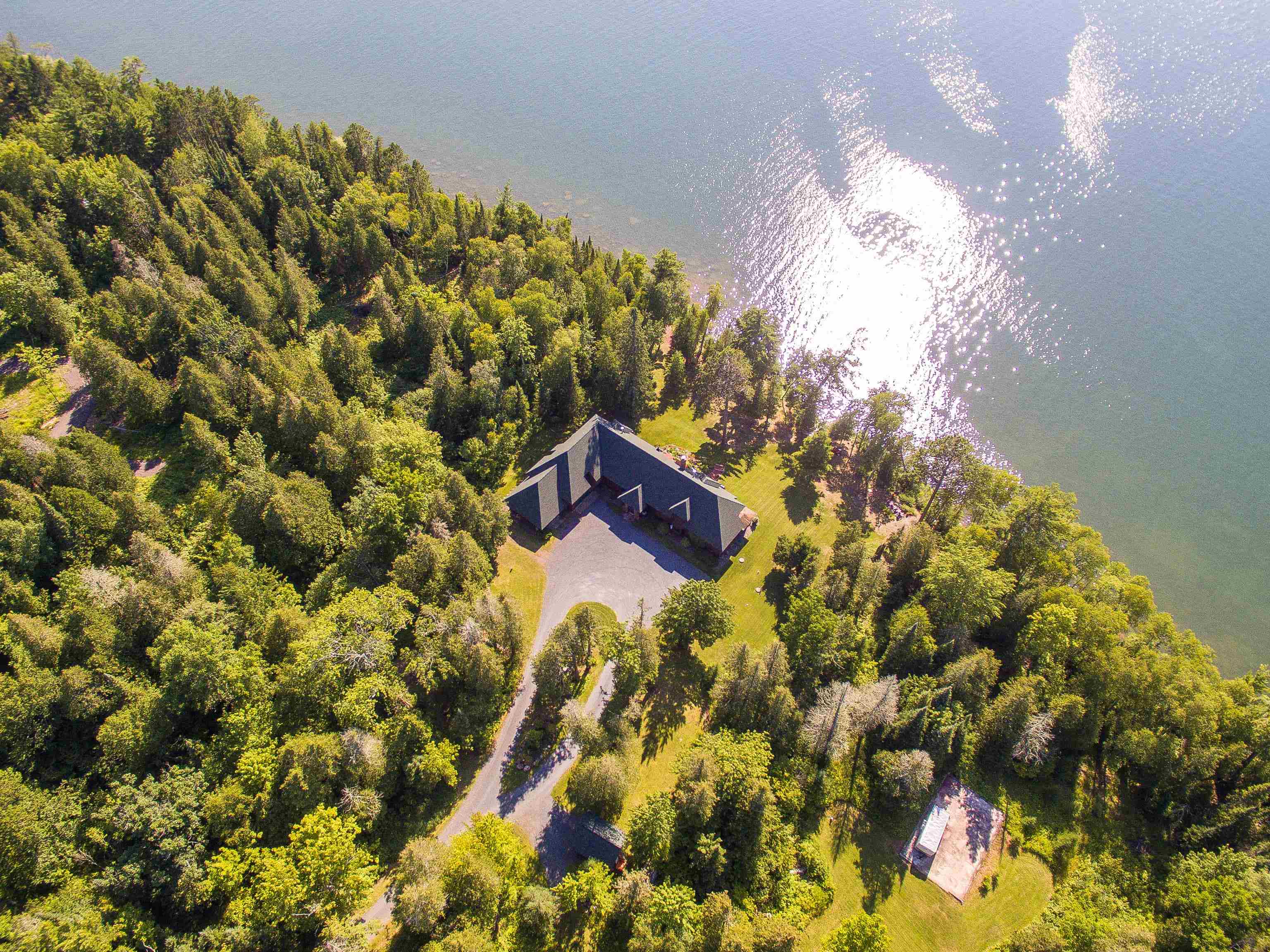 89405 Jack Pine Road Cornucopia, WI 54827 - Photo 7 of 60 Aerial view of property and surrounding area with a heavily wooded area