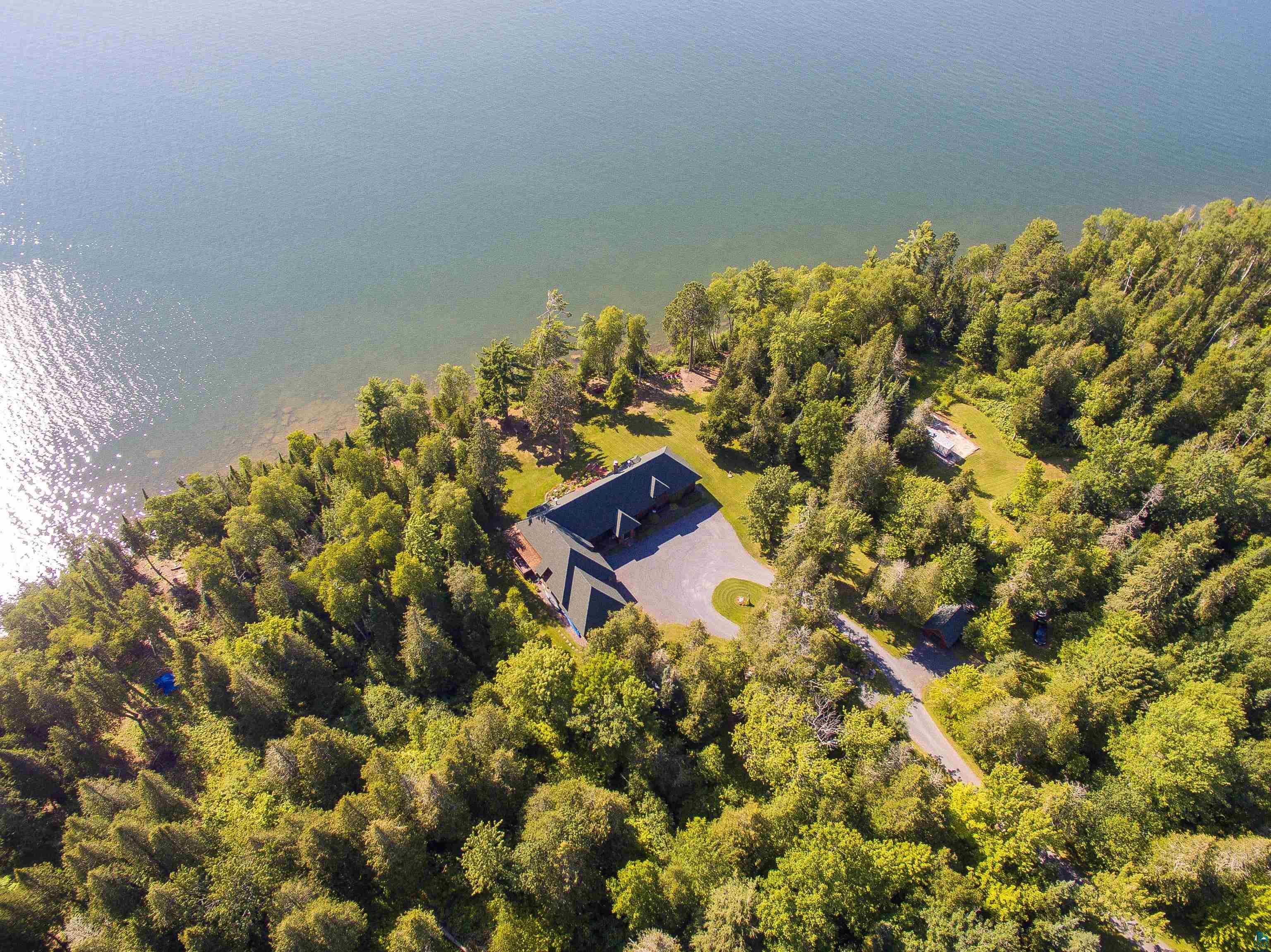 89405 Jack Pine Road Cornucopia, WI 54827 - Photo 8 of 60 Aerial view of property and surrounding area featuring a forest