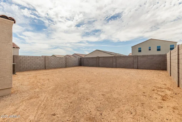 a view of a house with a yard and garage