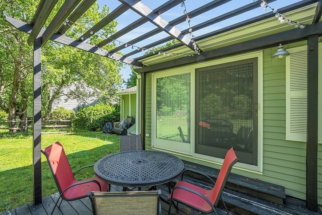 23 Birchwood Road Rutland, MA 01543 - Photo 8 of 35 a view of a patio with table and chairs and a barbeque