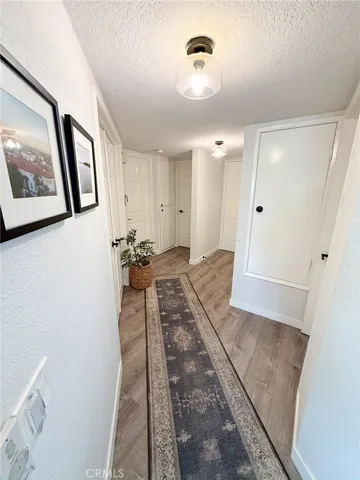 a view of a hallway with closet