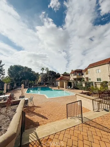 a view of swimming pool with outdoor seating