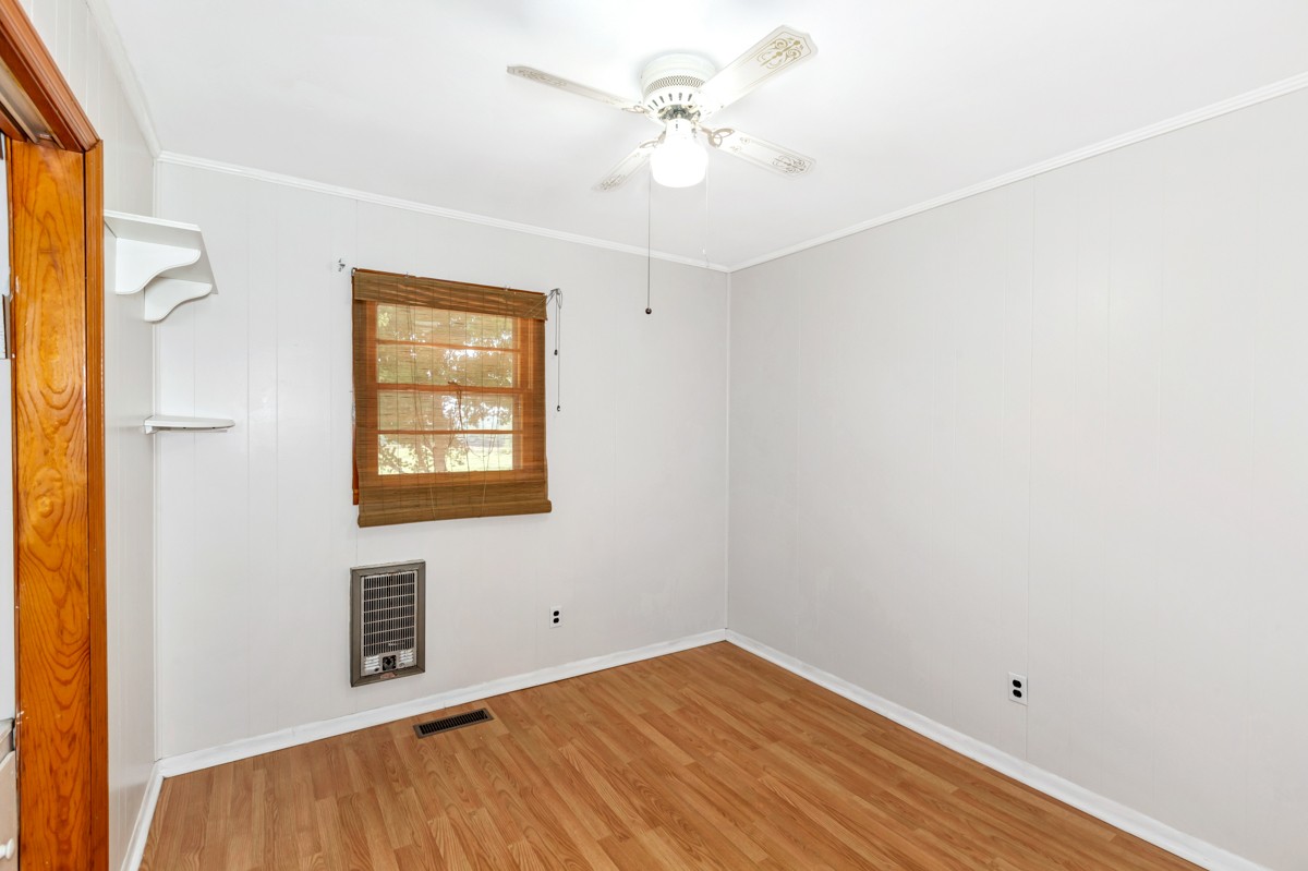 1758 Old Stage Road Ardmore, TN 38449 - Photo 14 of 25 an empty room with a window and a ceiling fan