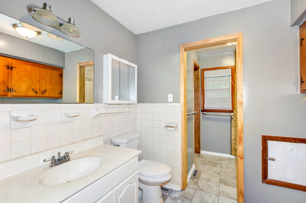 1758 Old Stage Road Ardmore, TN 38449 - Photo 15 of 25 a bathroom with a sink a toilet and shower
