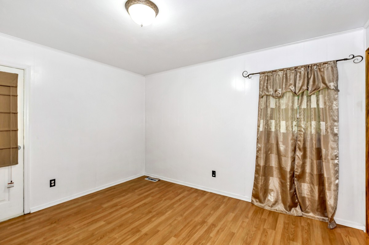 1758 Old Stage Road Ardmore, TN 38449 - Photo 18 of 25 a view of room with wooden floor
