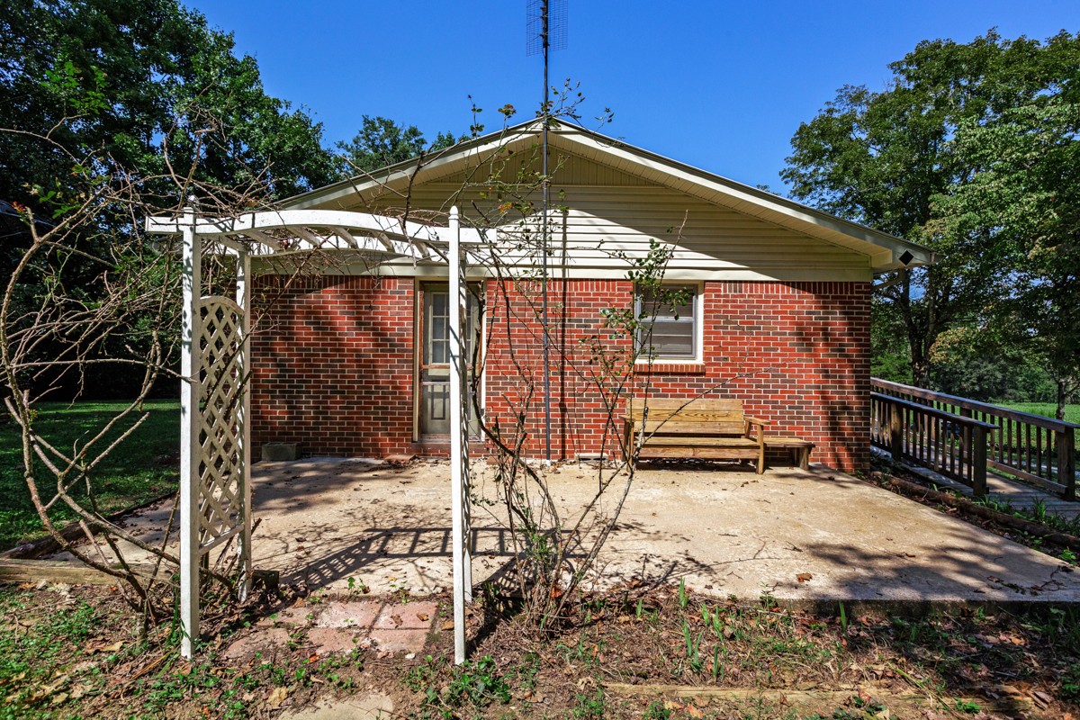 1758 Old Stage Road Ardmore, TN 38449 - Photo 4 of 25 a backyard of a house with lots of green space
