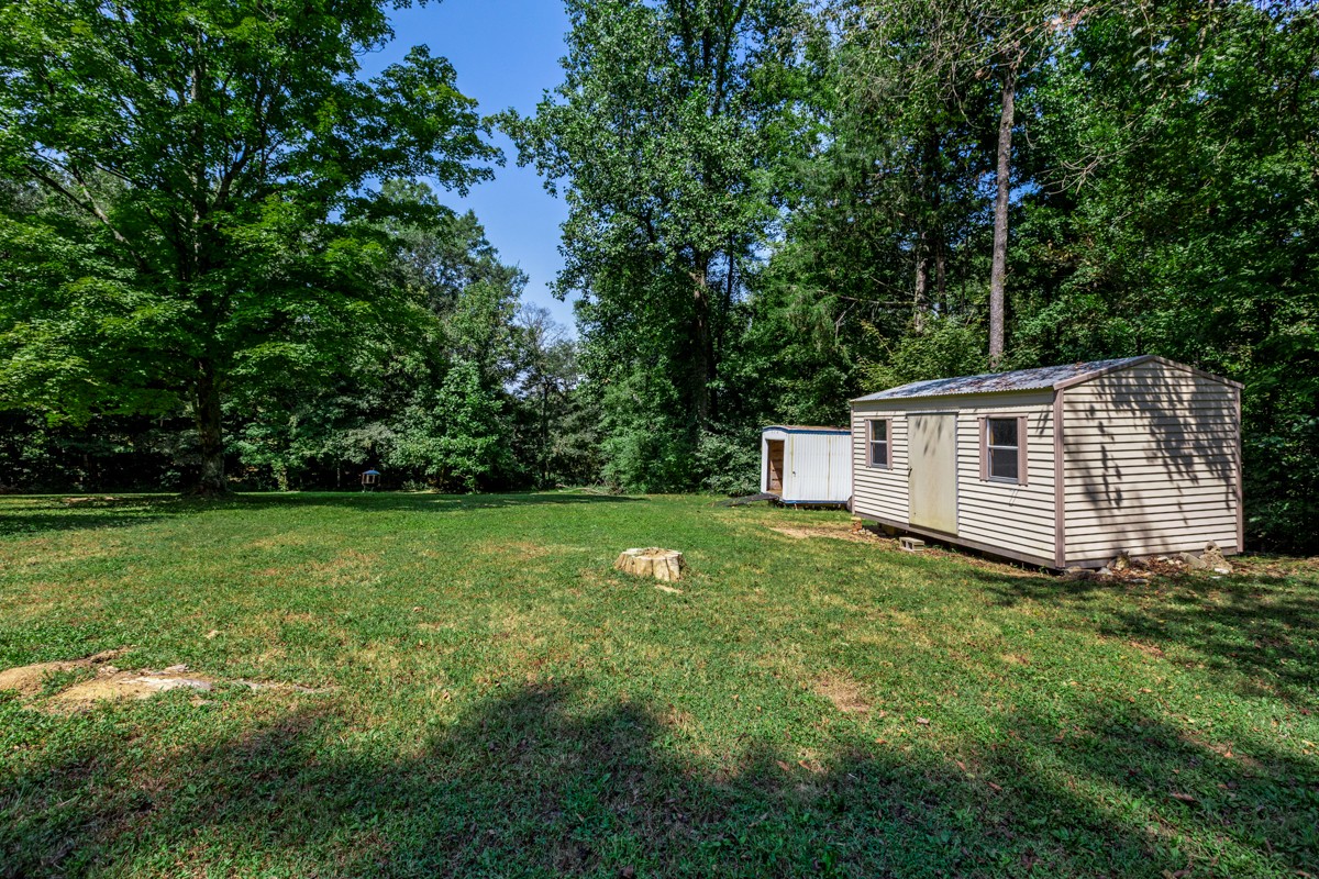 1758 Old Stage Road Ardmore, TN 38449 - Photo 6 of 25 a backyard of a house with lots of green space