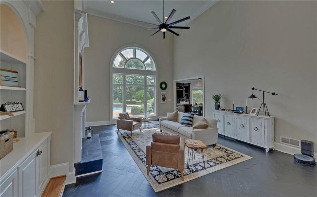 2760 Camp Branch Road Buford, GA 30519 - Photo 12 of 73 a living room with furniture large window and wooden floor