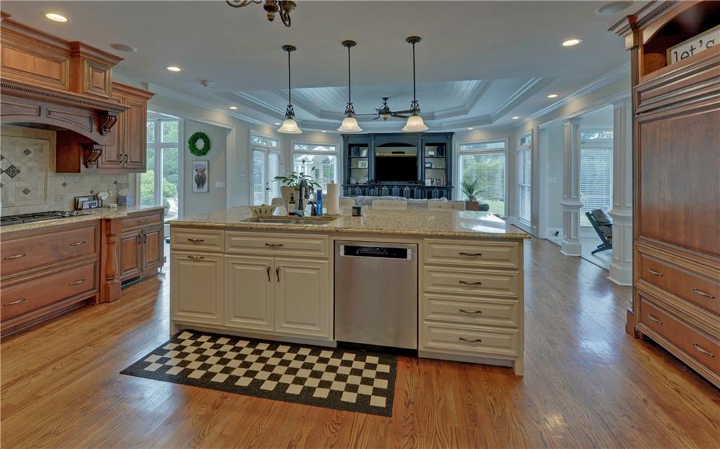 2760 Camp Branch Road Buford, GA 30519 - Photo 16 of 73 a kitchen with a sink and a stove top oven