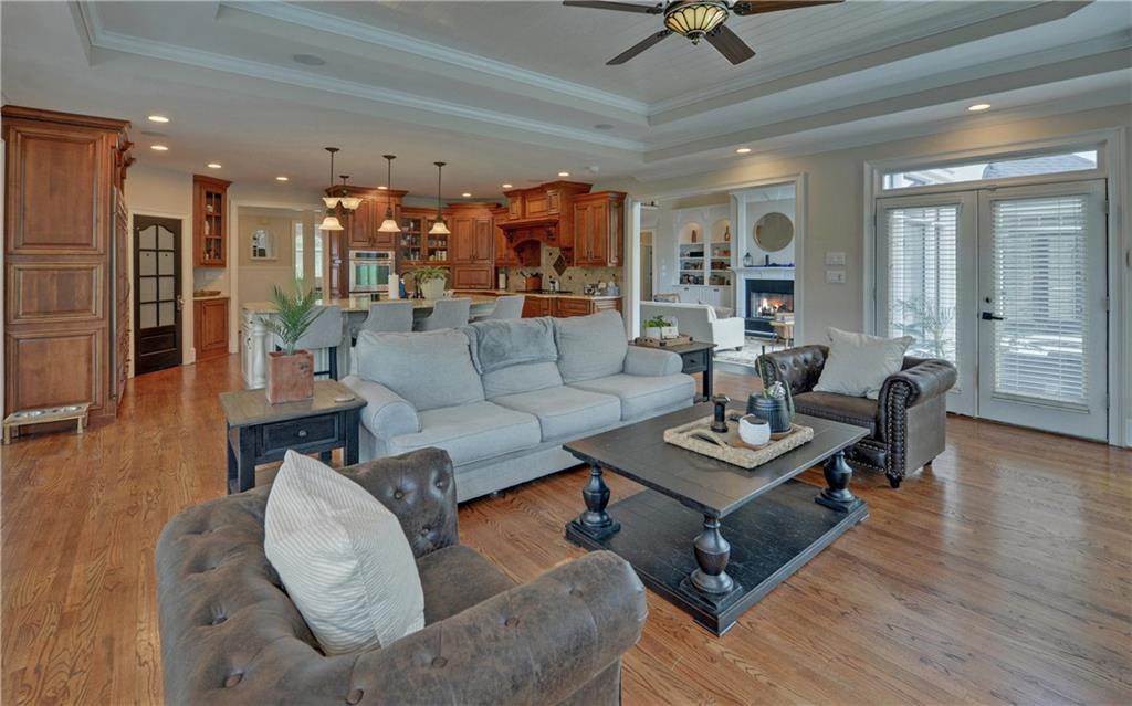 2760 Camp Branch Road Buford, GA 30519 - Photo 17 of 73 a living room with furniture and a wooden floor
