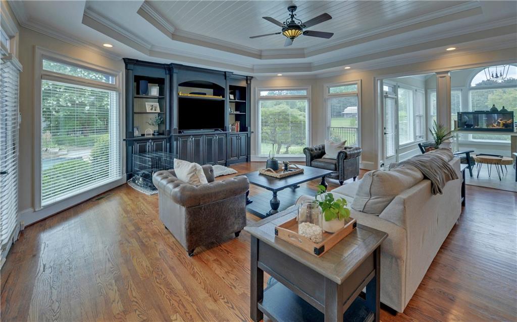 2760 Camp Branch Road Buford, GA 30519 - Photo 18 of 73 a living room with furniture large window and wooden floor