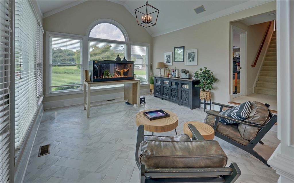 2760 Camp Branch Road Buford, GA 30519 - Photo 20 of 73 a living room with furniture and a fireplace