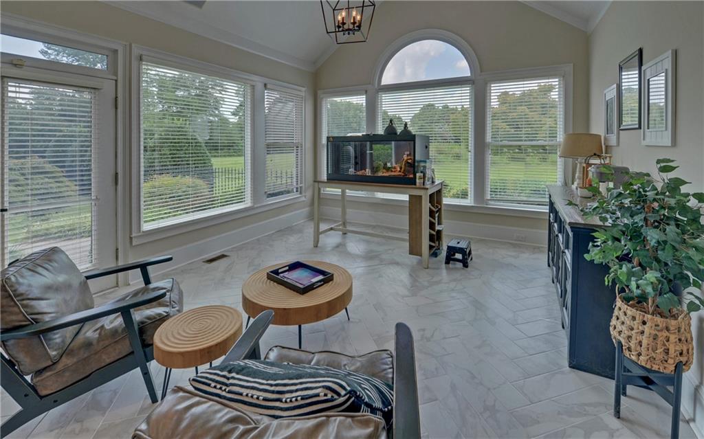 2760 Camp Branch Road Buford, GA 30519 - Photo 21 of 73 a room with lots of furniture and a large window