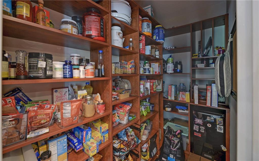 2760 Camp Branch Road Buford, GA 30519 - Photo 22 of 73 a room with lots of books and a large window
