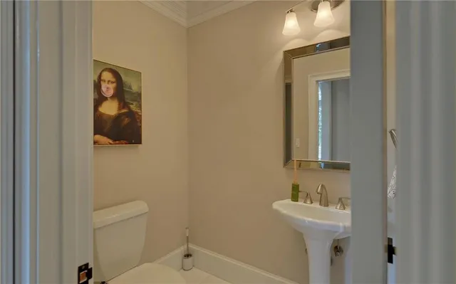 a bathroom with a bathtub a sink and a large mirror