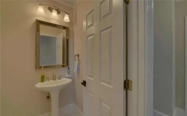 walk in closet with clothes and shoes