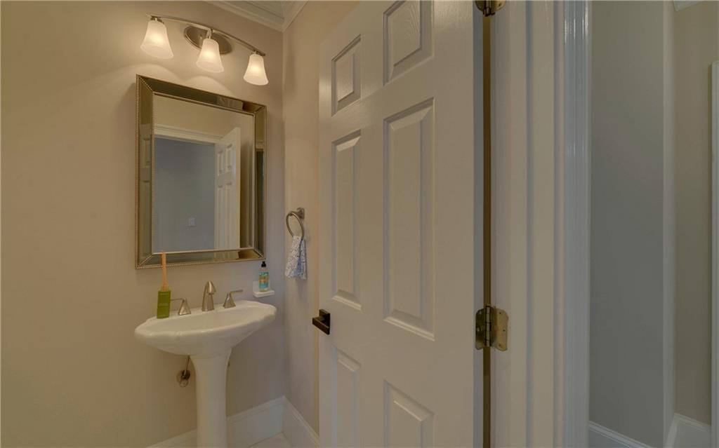 2760 Camp Branch Road Buford, GA 30519 - Photo 26 of 73 a bathroom with a sink and a mirror