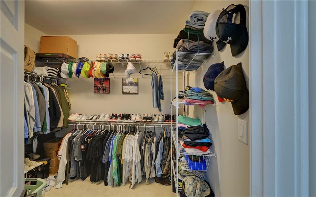 2760 Camp Branch Road Buford, GA 30519 - Photo 35 of 73 walk in closet with clothes and shoes