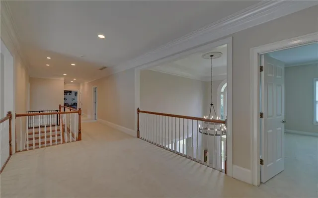 an empty room with a ceiling fan and a window