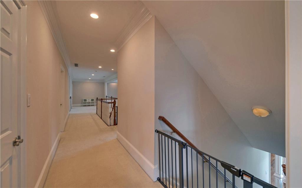 2760 Camp Branch Road Buford, GA 30519 - Photo 39 of 73 a view of a hallway with wooden floor and staircase