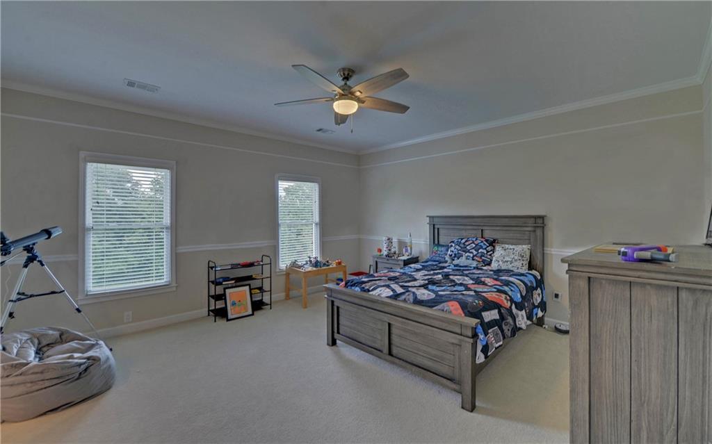 2760 Camp Branch Road Buford, GA 30519 - Photo 40 of 73 a bedroom with bed and window