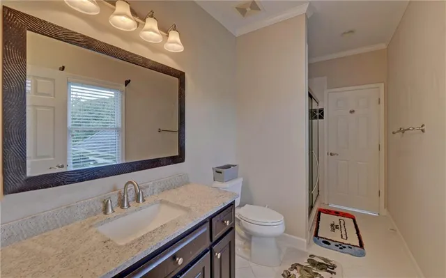 a kitchen with stainless steel appliances granite countertop white cabinets a sink and dishwasher