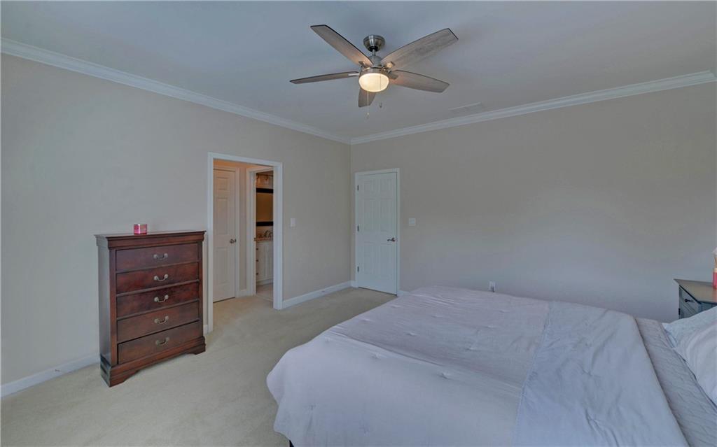 2760 Camp Branch Road Buford, GA 30519 - Photo 47 of 73 a bedroom with a bed and a ceiling fan