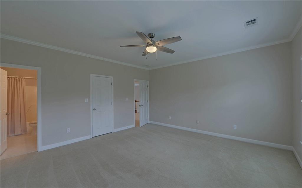 2760 Camp Branch Road Buford, GA 30519 - Photo 50 of 73 an empty room with a ceiling fan and a window