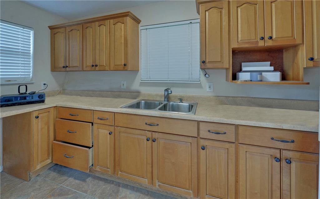 2760 Camp Branch Road Buford, GA 30519 - Photo 61 of 73 a kitchen with stainless steel appliances granite countertop white cabinets a sink and dishwasher