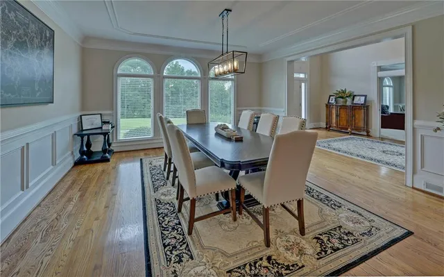 a work room with furniture and a large window