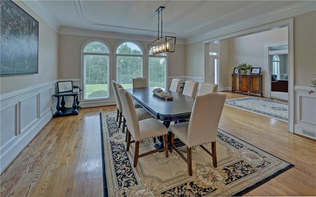 2760 Camp Branch Road Buford, GA 30519 - Photo 8 of 73 a view of a dining room with furniture window and wooden floor