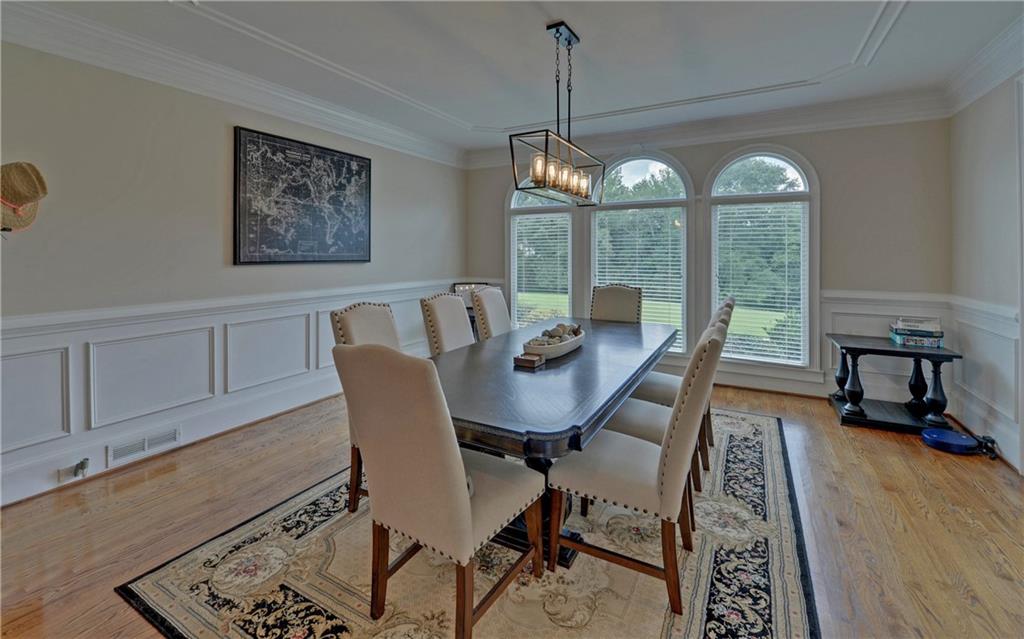 2760 Camp Branch Road Buford, GA 30519 - Photo 9 of 73 a view of a dining room with furniture window and wooden floor