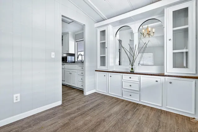 a view of a livingroom with wooden floor