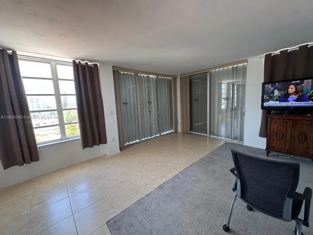 a view of livingroom with furniture and a flat screen tv