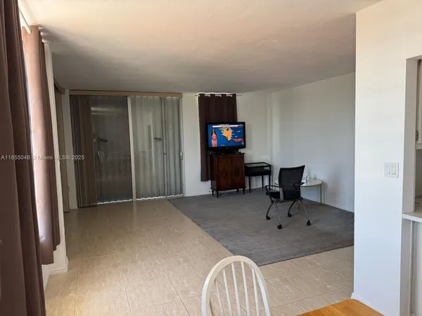 a room with furniture and flat screen tv